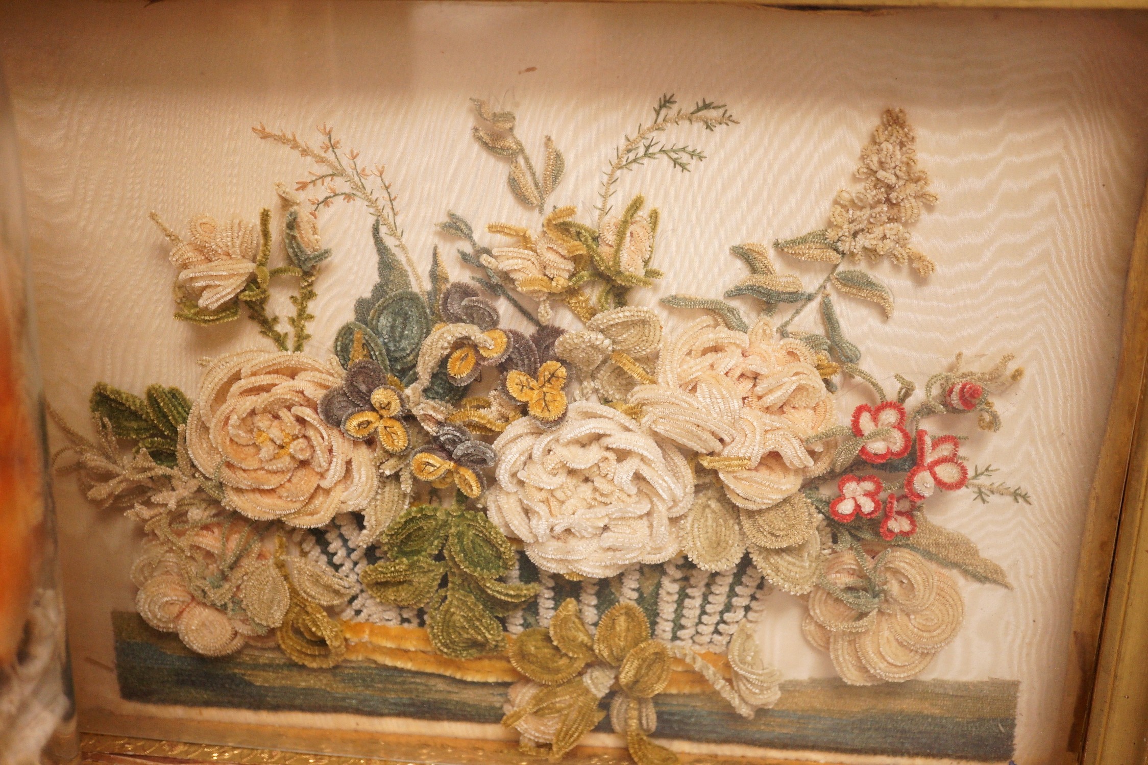 A Victorian chenille bouquet, framed and a shell arrangement, under a glass dome